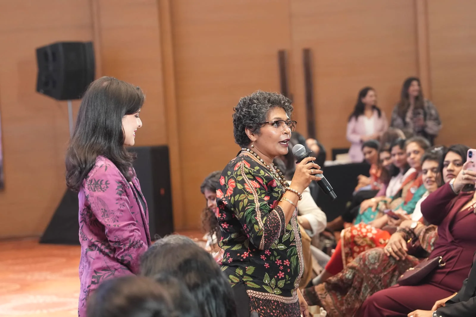 Clients sharing their stories on stage